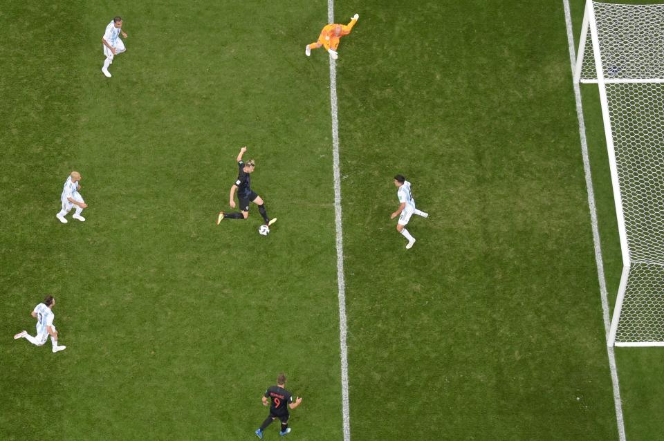  Game over: Ivan Rakitic taps in number three for Croatia as Argentina's players stand and watch. (Getty)