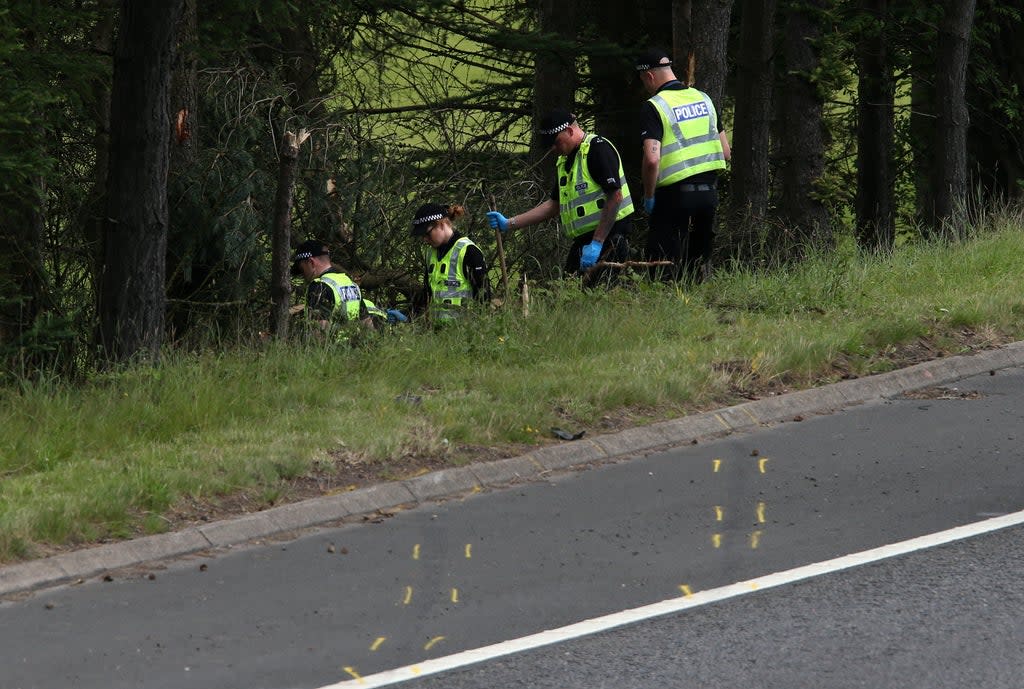 Police officers at the site of the crash on the M9 near Stirling (Andrew Milligan/PA) (PA Wire)