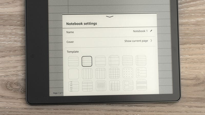 A close-up of the on-screen template options for the Kindle Scribe's notebooks, with the device sitting on a wooden table.