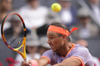 Rafael Nadal of Spain returns the ball to Pedro Cachin of Argentina during the Mutua Madrid Open tennis tournament in Madrid, Spain, Monday, April 29, 2024. (AP Photo/Manu Fernandez)