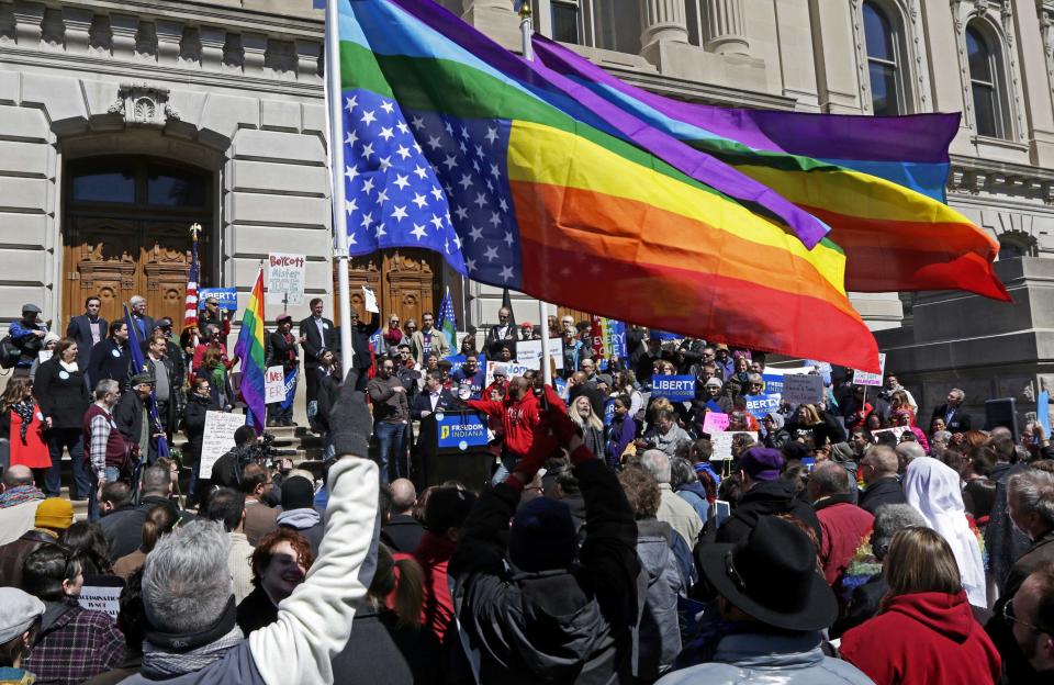 Demonstrators gather at Monument Circle to protest a controversial religious freedom bill recently signed by Governor Mike Pence, during a rally in Indianapolis March 28, 2015. More than 2,000 people gathered at the Indiana State Capital Saturday to protest Indiana's newly signed Religious Freedom Restoration Act saying it would promote discrimination against individuals based on sexual orientation. (REUTERS/Nate Chute)