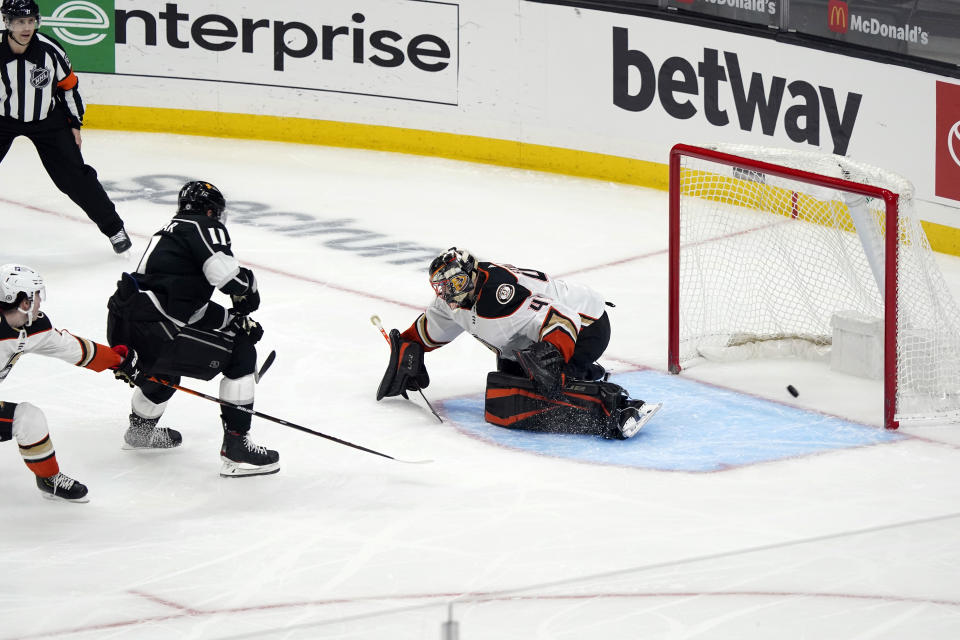 Los Angeles Kings center Anze Kopitar (11) scores past Anaheim Ducks goaltender Anthony Stolarz during the second period of an NHL hockey game Tuesday, April 20, 2021, in Los Angeles. (AP Photo/Marcio Jose Sanchez)