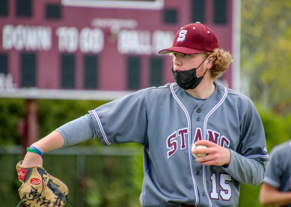 Bishop Stang pitcher Seamus Marshall goes through some throws prior to the inning against Dartmouth