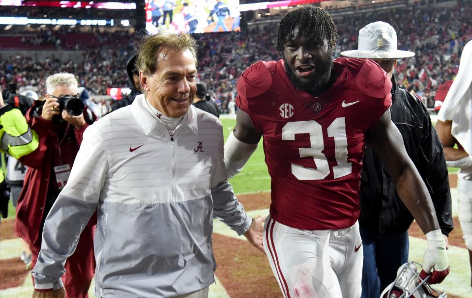 Alabama coach Nick Saban and linebacker Will Anderson Jr. (31) share a smile as they leave the field after the Iron Bowl. z(Gary Cosby Jr, -USA TODAY Sports)