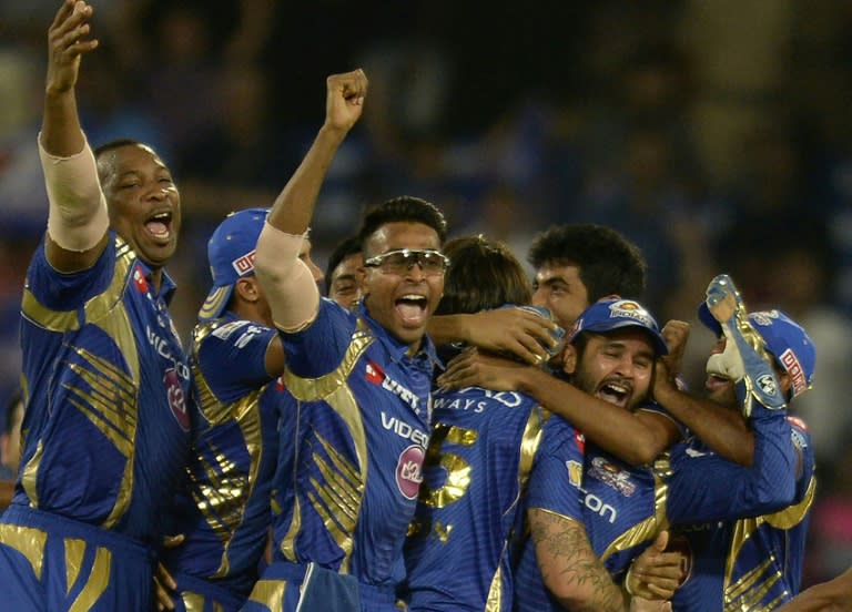 Mumbai Indians cricketers celebrate their victory against Rising Pune Supergiant in the Indian Premier League final at The Rajiv Gandhi International Cricket Stadium in Hyderabad on May 21, 2017