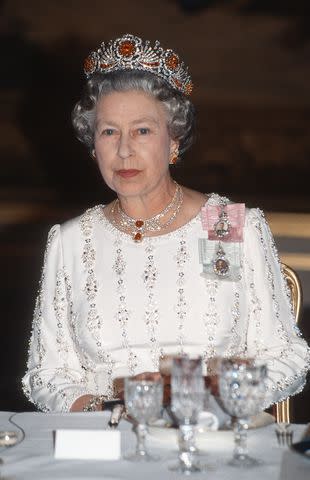 <p>Anwar Hussein/Getty</p> Queen Elizabeth wears the Burmese Ruby Tiara.