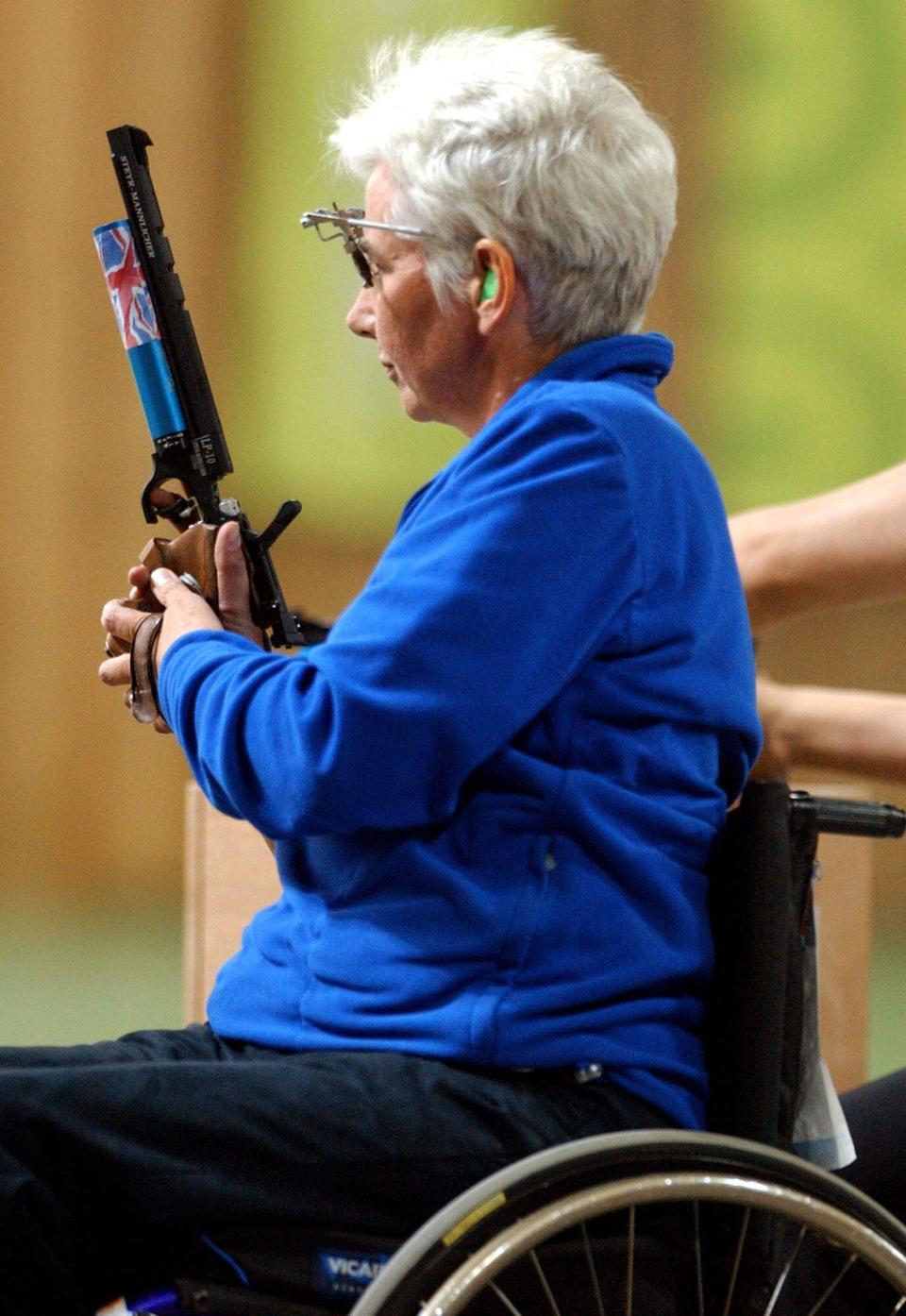 Britain's Isabel Newstead competes during the 10m Air Pistol SH1 final at the Athens 2004 Paralympic Games in the Olympic Shooting Center on Sunday, Sept. 19, 2004. Newstead won the gold medal. (AP Photo/Thanassis Stavrakis)