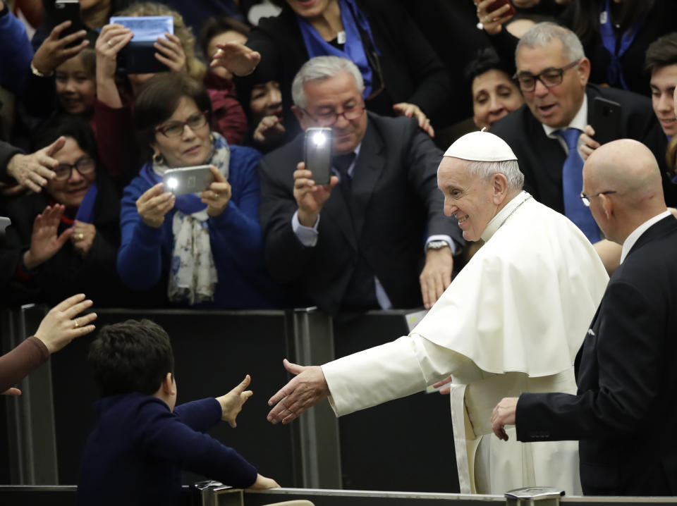 Pope Francis leaves at the end of his weekly general audience in the Paul VI Hall at the Vatican, Wednesday, Feb. 20, 2019. (AP Photo/Alessandra Tarantino)