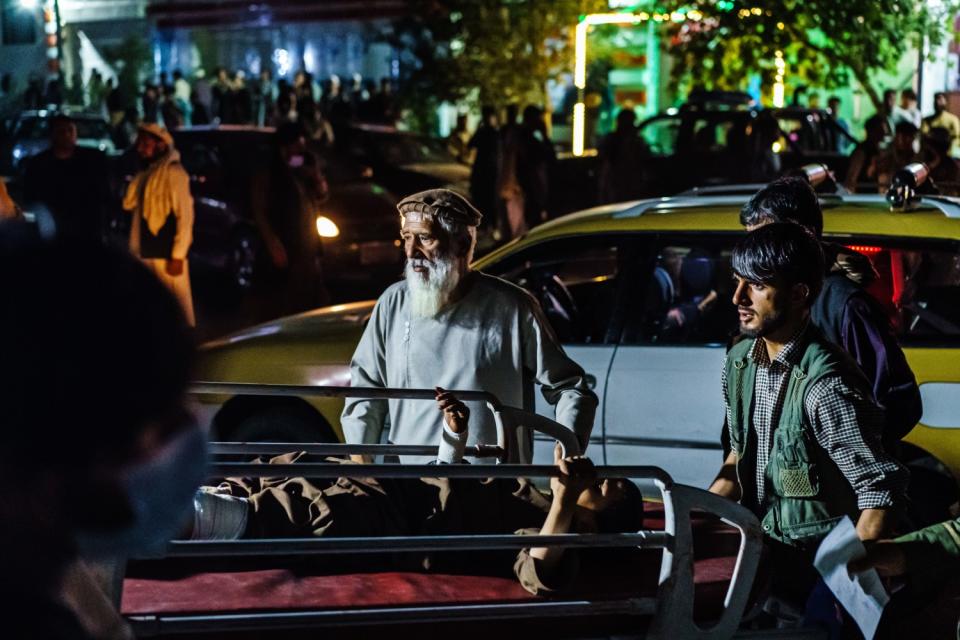 A wounded patient is brought by taxi to a hospital in Kabul, Afghanistan.