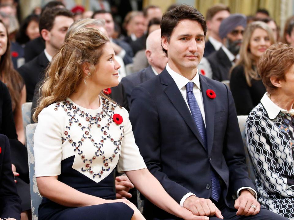 Justin Trudeau and his wife Sophie Gregoire hold hands before he is sworn-in as Canada's 23rd prime minister during a ceremony at Rideau Hall in Ottawa November 4, 2015.