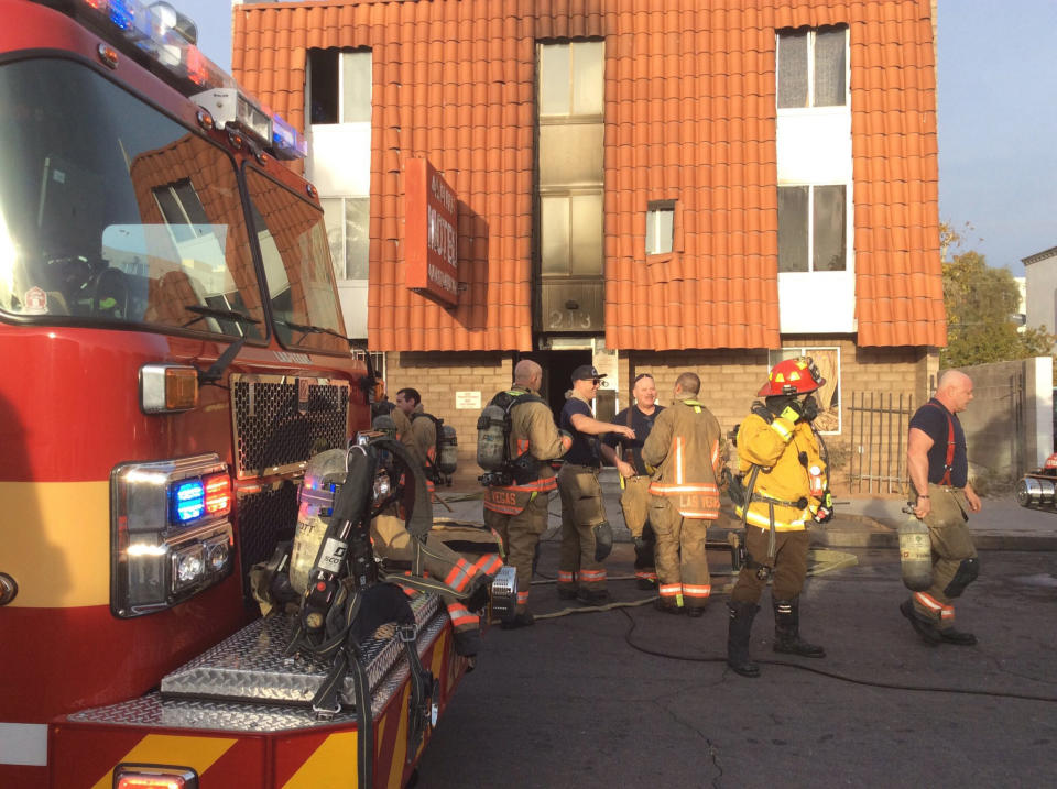 This photo provided by the Las Vegas Fire Department, firefighters work the scene of a fire at a three-story apartment complex early Saturday, Dec. 21, 2019 in Las Vegas. The fire was in first-floor unit of the Alpine Motel Apartments and its cause was under investigation, the department said. Authorities say multiple fatalities were reported and several were injured. (Las Vegas Fire Department via AP)