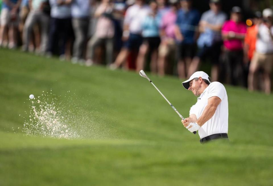 Rory McIlroy hits out of a bunker on the 10th hole during round one of the Wells Fargo Championship at Quail Hollow Club in Charlotte, N.C., on Thursday, May 9, 2024.