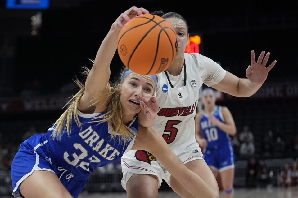 Drake forward Courtney Becker (32) and Louisville guard Mykasa Robinson (5) chase a loose ball during the second half of a first-round college basketball game in the NCAA Tournament in Austin, Texas, Saturday, March 18, 2023. (AP Photo/Eric Gay)