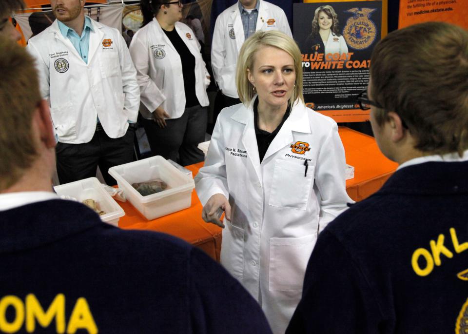 Kayse Shrum, then the president of the OSU Center for Health Sciences, speaks to students about pursuing a career in medicine at an FFA event at the Cox Convention Center in Oklahoma City on April 29, 2014.