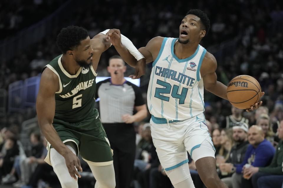 Charlotte Hornets' Brandon Miller tries to get past Milwaukee Bucks' Malik Beasley during the second half of an NBA basketball game Friday, Feb. 9, 2024, in Milwaukee. (AP Photo/Morry Gash)