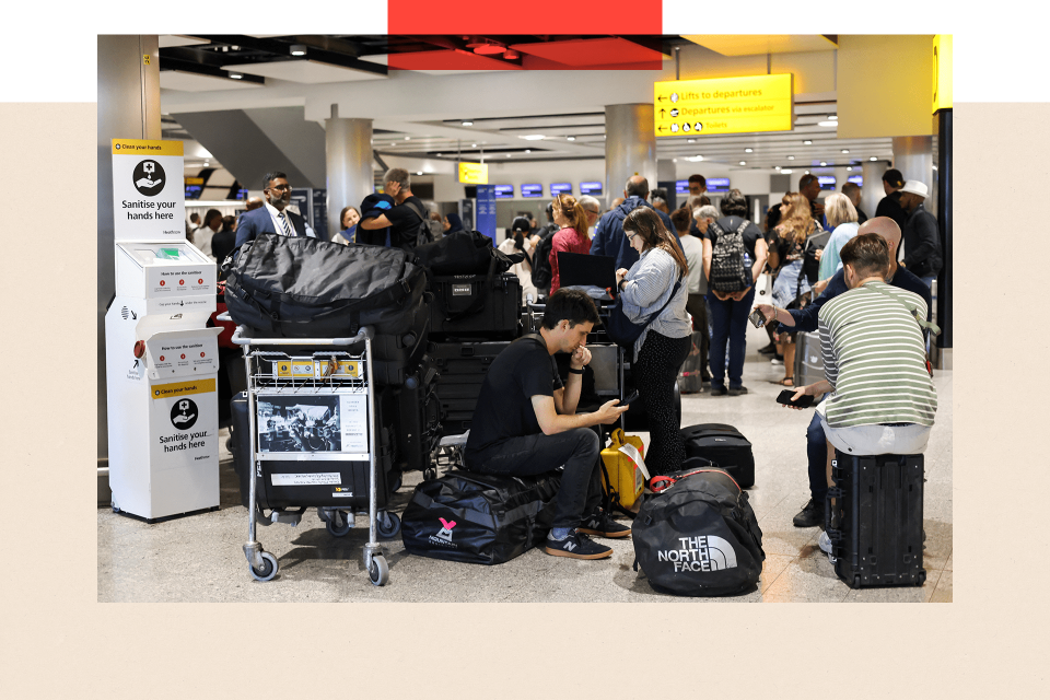 Travellers wait near the British Airways check-in area at Heathrow Airport, as Nats restricts UK air traffic due to a technical issue causing delays