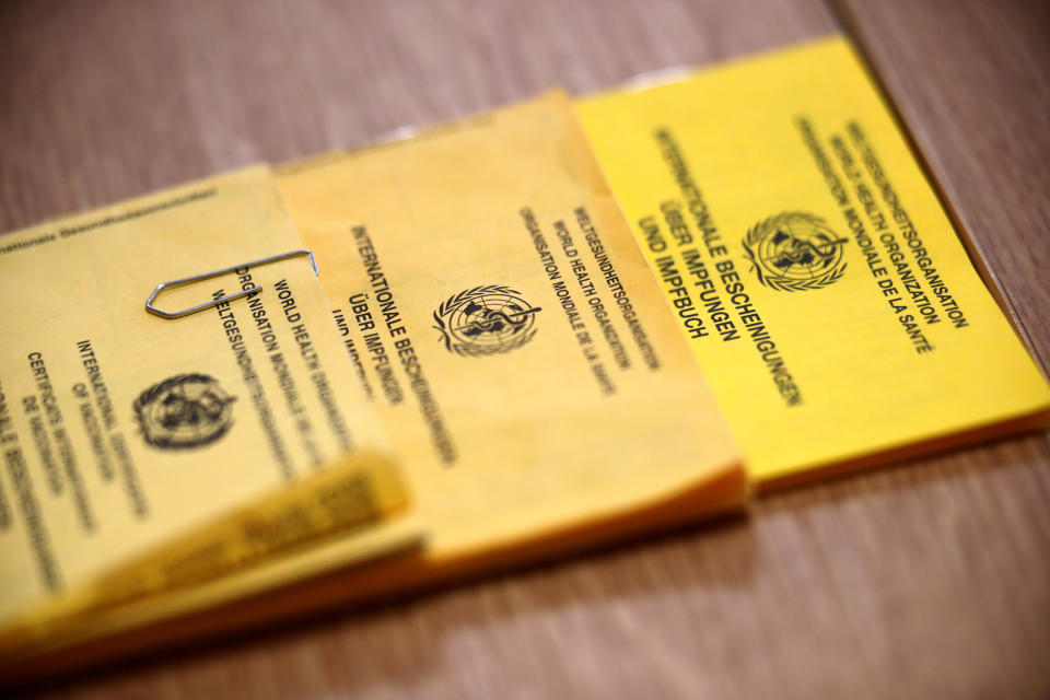 Image: Vaccination cards are displayed as elderly people receive the Pfizer-BioNTech coronavirus disease (COVID-19) vaccine at a nursing home in Burgbernheim, Germany (Hannibal Hanschke / Reuters)