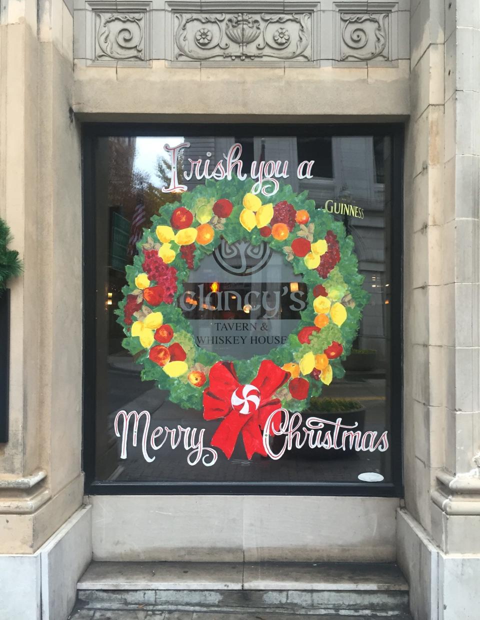 Knox Flair artist Bud Ries paints seasonal, temporary window decorations around downtown Knoxville.