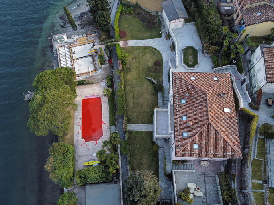 The swimming pool of a villa owned by Russian tv presenter Vladimir Solovyov is seen coloured red after being vandalised in Italy on April 6