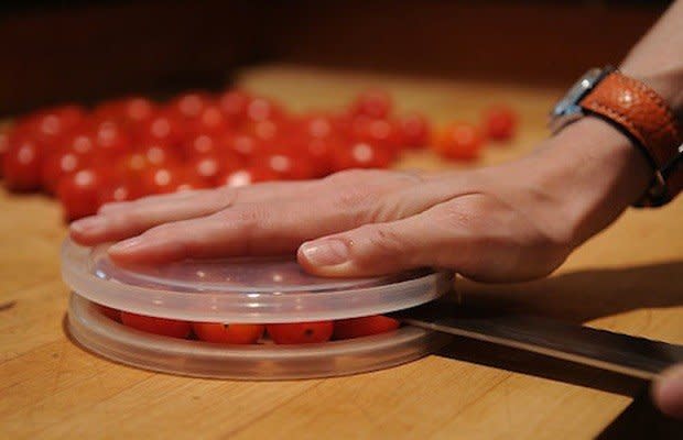 If you're slicing cherry tomatoes in half one by one, you're doing it wrong. Save time and cut more than you can eat in one swoop of the knife. To be a tomato-cutting ninja just place the cherry tomatoes on a plate, top with another plate, and slide a knife between the two. Ta da! <a href="http://www.huffingtonpost.com/2014/04/16/cut-tomatoes-ninja-cooking-hack_n_5161260.html" target="_blank"> Watch the video</a> for more detailed instruction. 