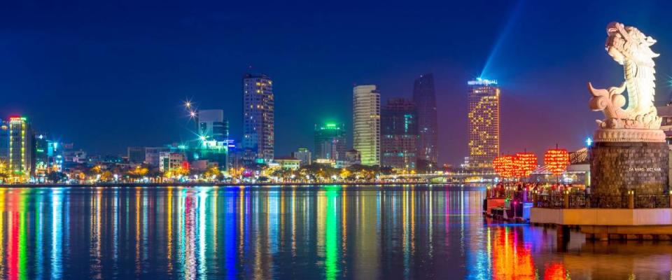 skyline of da nang by han river with carp dragon