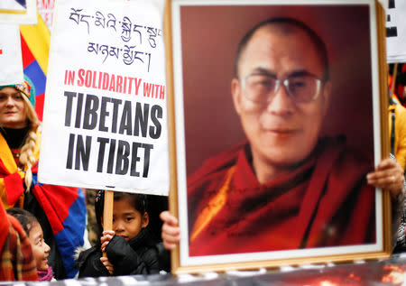 People mark the anniversary of the 1959 uprising in Tibet against Chinese rule at a demonstration opposite Downing Street in London, Britain, March 10, 2018. REUTERS/ Henry Nicholls/Files