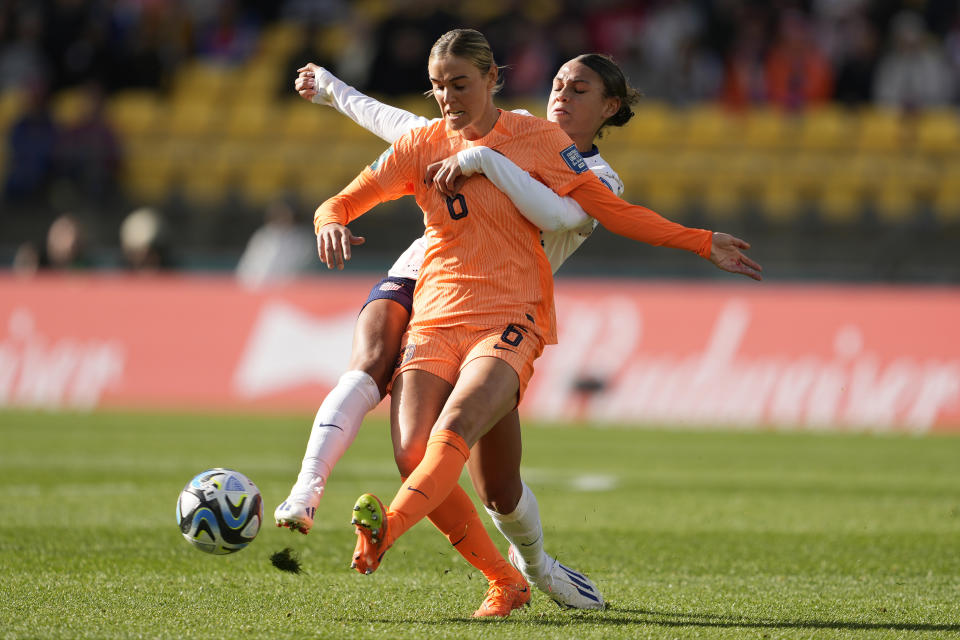 Netherlands' Jill Roord, front, and United States' Trinity Rodman battle for possession during the first half of the FIFA Women's World Cup Group E soccer match between the United States and the Netherlands in Wellington, New Zealand, Thursday, July 27, 2023. (AP Photo/John Cowpland)