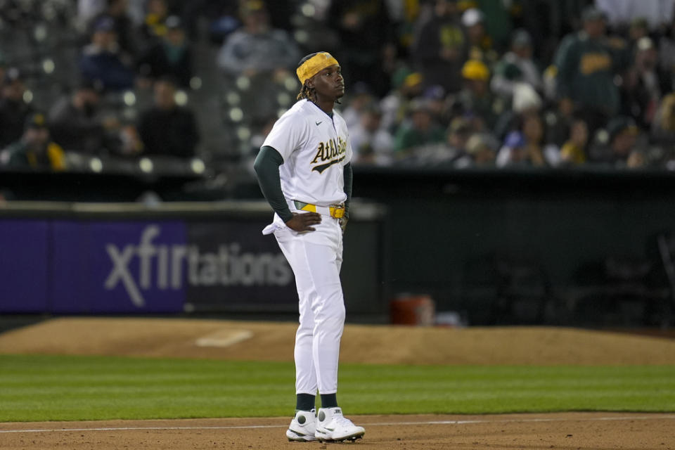 Oakland Athletics’ Lawrence Butler reacts after being tagged out at third base on a throw by Cleveland Guardians right fielder Ramón Laureano during the fifth inning of a baseball game Thursday, March 28, 2024, in Oakland, Calif. (AP Photo/Godofredo A. Vásquez)