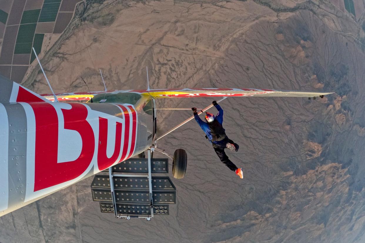 Pilot Luke Aikins is seen successfully entering the silver plane during the stunt.