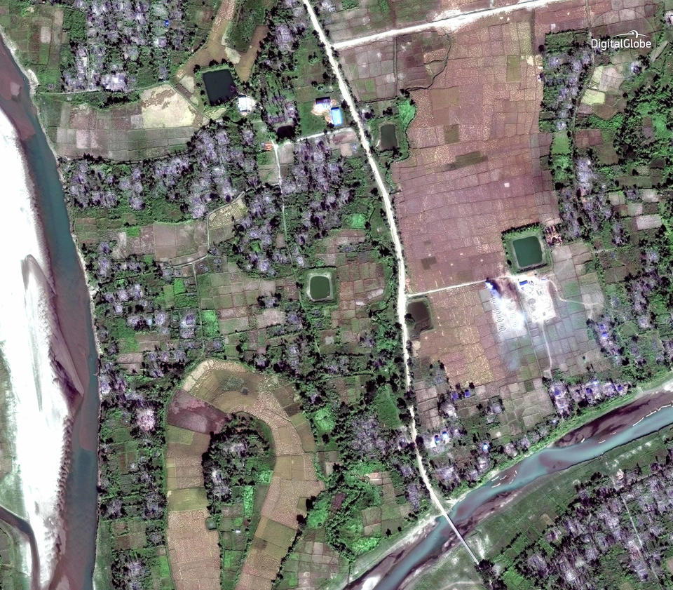 This Dec. 2, 2017, satellite image provided by DigitalGlobe, shows the village of Thit Tone Nar Gwa Son, about 50 kilometers (31 miles) north of Maungdaw, Rakhine state, Myanmar.