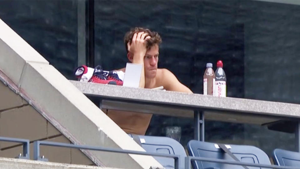 Diego Schwartzman (pictured) wth his hands on his head watching on in Arthur Ashe stadium.