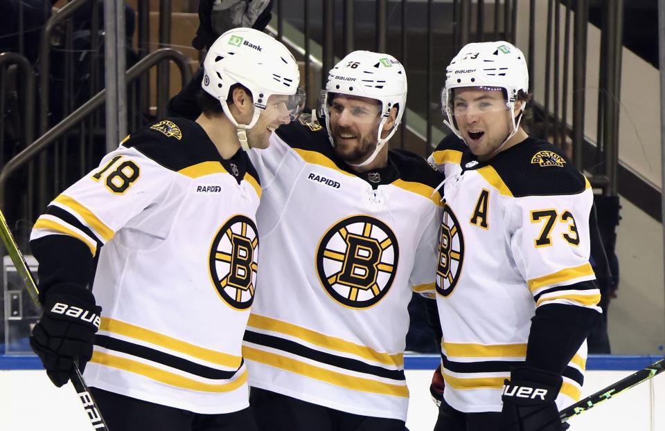 NEW YORK, NEW YORK - JANUARY 19: Pavel Zacha #18 of the Boston Bruins (L) celebrates his first period goal against the New York Rangers and is joined by David Krejci #46 (C) and Charlie McAvoy #73 (R) at Madison Square Garden on January 19, 2023 in New York City. (Photo by Bruce Bennett/Getty Images)