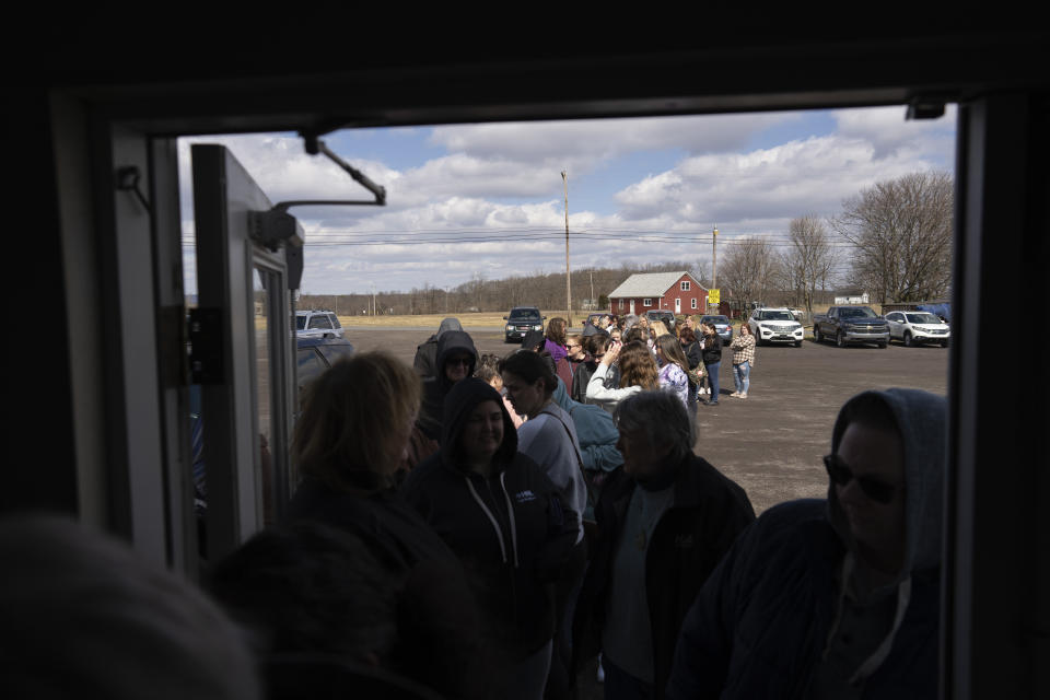 Ticket holders line up before the doors open for the sold-out "Drag Bingo" fundraiser at the Nescopeck Township Volunteer Fire Company Social Hall, in Nescopeck, Pa., Saturday, March 18, 2023, to raise money for a new roof for the Berwick Theater and Center for Community Arts, in Berwick, Pa. (AP Photo/Carolyn Kaster)