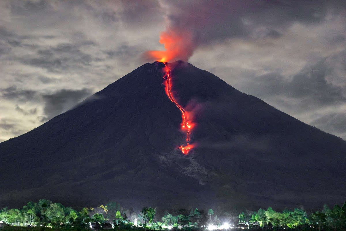 Lava hisses down Java’s Mount Semeru, which erupted on 4 December 2021 (AFP via Getty Images)