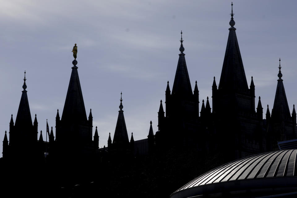 FILE - In this April 4, 2020, file photo, is The Salt Lake Temple of The Church of Jesus Christ of Latter-day Saints in Salt Lake City. The Church of Jesus Christ of Latter-day Saints has announced that face masks will be required inside temples to limit the spread of COVID-19. Church leaders said Wednesday, Sept. 22, 2021, that masks will be required temporarily in an effort to keep temples open. (AP Photo/Rick Bowmer, File)