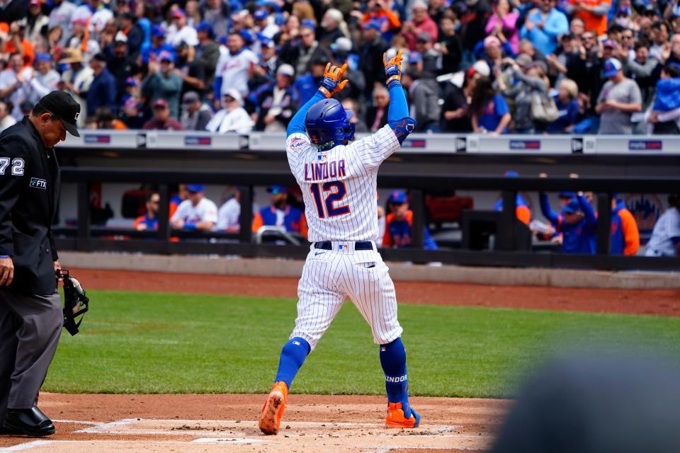 New York Mets designated hitter Francisco Lindor (12) reacts to hitting a home run as he crosses home plate against the San Francisco Giants during the first inning at Citi Field.