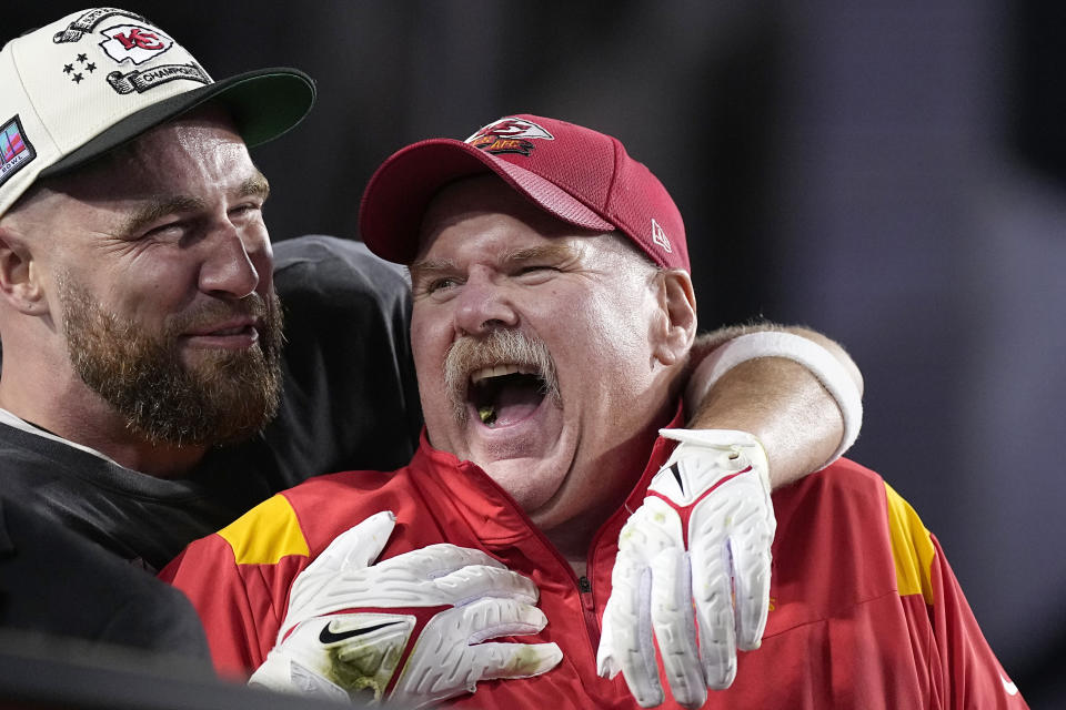 Kansas City Chiefs tight end Travis Kelce, left, and head coach Andy Reid celebrate victory over the Philadelphia Eagles after the NFL Super Bowl 57 football game, Sunday, Feb. 12, 2023, in Glendale, Ariz. The Kansas City Chiefs defeated the Philadelphia Eagles 38-35. (AP Photo/Brynn Anderson)