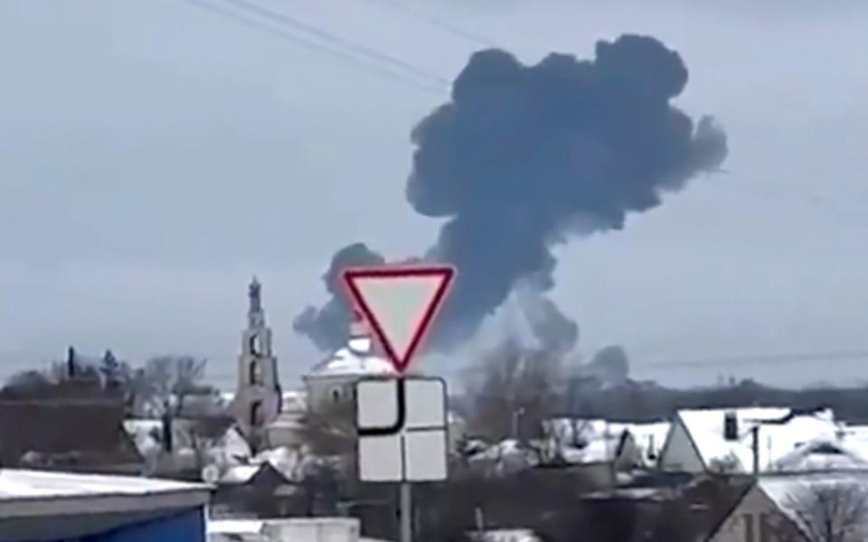smoke rises from the scene of a warplane crash at a residential area near Yablonovo, Belgorod region