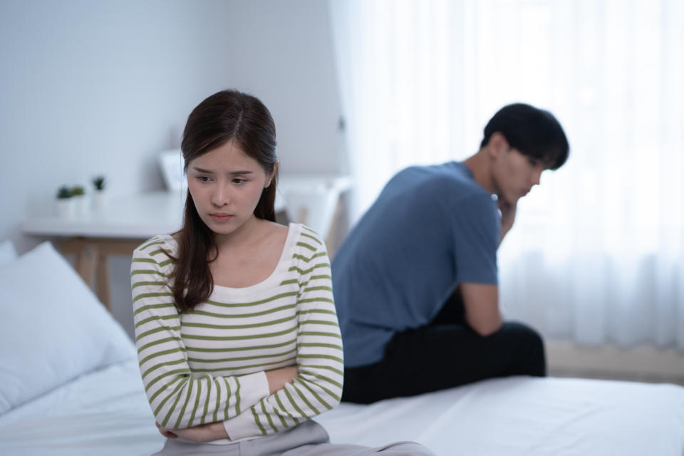 couple sulking in bedroom