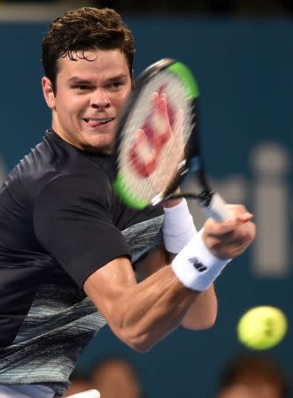 Tennis - Brisbane International - Pat Rafter Arena, Brisbane, Australia - 6/1/17 - Canada's Milos Raonic hits a shot during his match against Spain's Rafael Nadal. REUTERS/Steve Holland