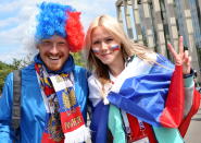 <p>National pride: Russian supporters show off their country’s colours in Moscow ahead of the first fixture. (EPA) </p>