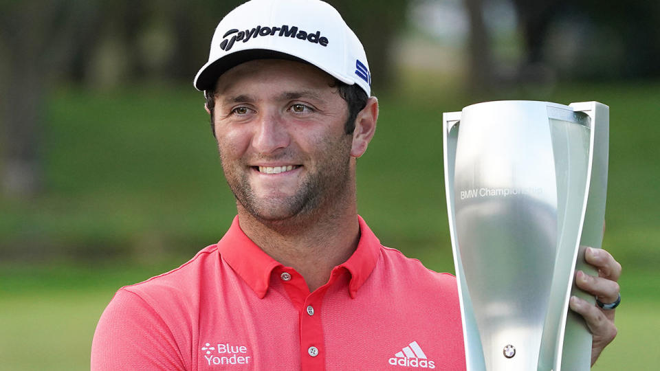 Seen here, Jon Rahm poses with the BMW Championship trophy.