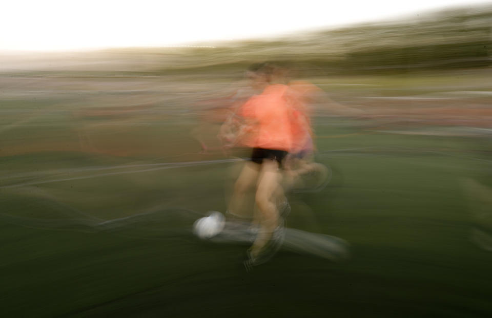 In this Jan. 30, 2019 photo, a woman plays in a soccer match in Buenos Aires, Argentina. Men's soccer has been a professional sport in Argentina since 1931, and yet, 88 years later, women's soccer is still amateur. (AP Photo/Natacha Pisarenko)