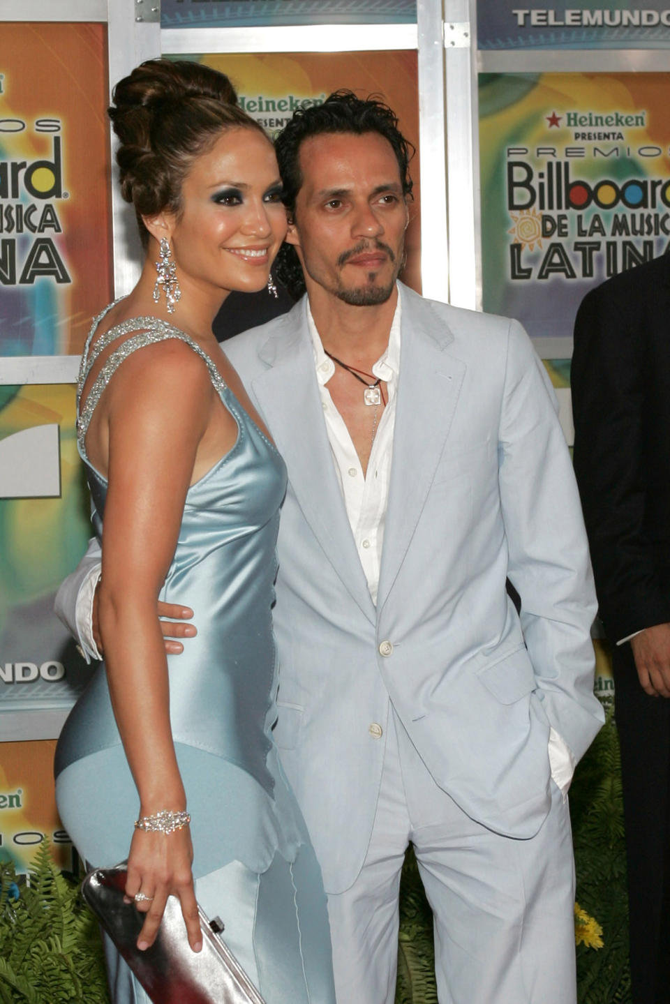 JLo and Marc posing at a media event