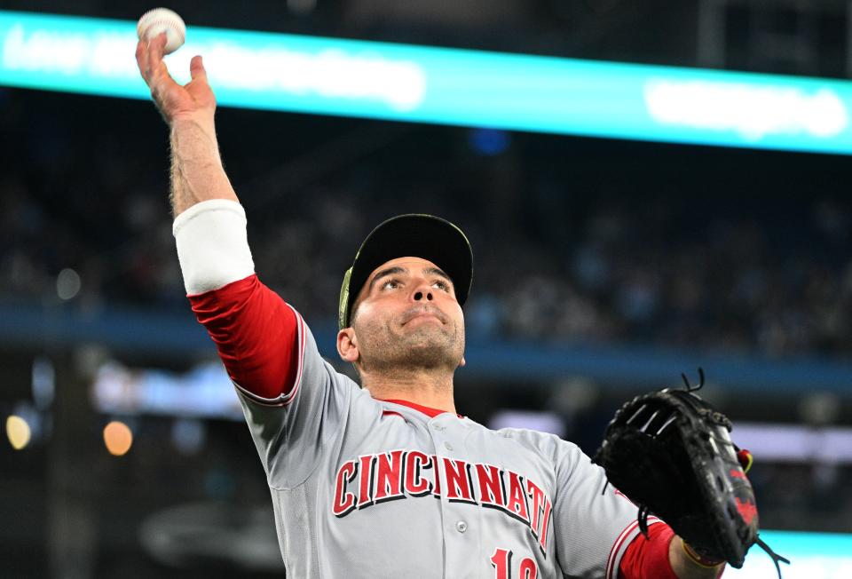 May 20, 2022; Toronto, Ontario, CAN; Cincinnati Reds first baseman Joey Votto (19) throws a baseball to fans after the end of the eighth inning against the Toronto Blue Jays at Rogers Centre. Mandatory Credit: Dan Hamilton-USA TODAY Sports