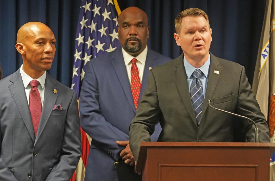 Homeland Security Investigations Detroit Acting Special Agent in Charge Shawn Gibson (right) addresses the media after Banmeet Singh accepted a plea deal in a dark web narcotics ring. Beside him is DEA Special Agent in Charge Orville O. Greene (left) and U.S. Attorney Kenneth L. Parker (center). Singh's case is believed to be the largest single cryptocurrency financial seizure in DEA history.