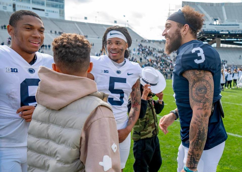 Wide receivers Harrison Wallace III, Omari Evans and Julian Fleming joke around after the Blue-White game on Saturday, April 13, 2024. Abby Drey/adrey@centredaily.com