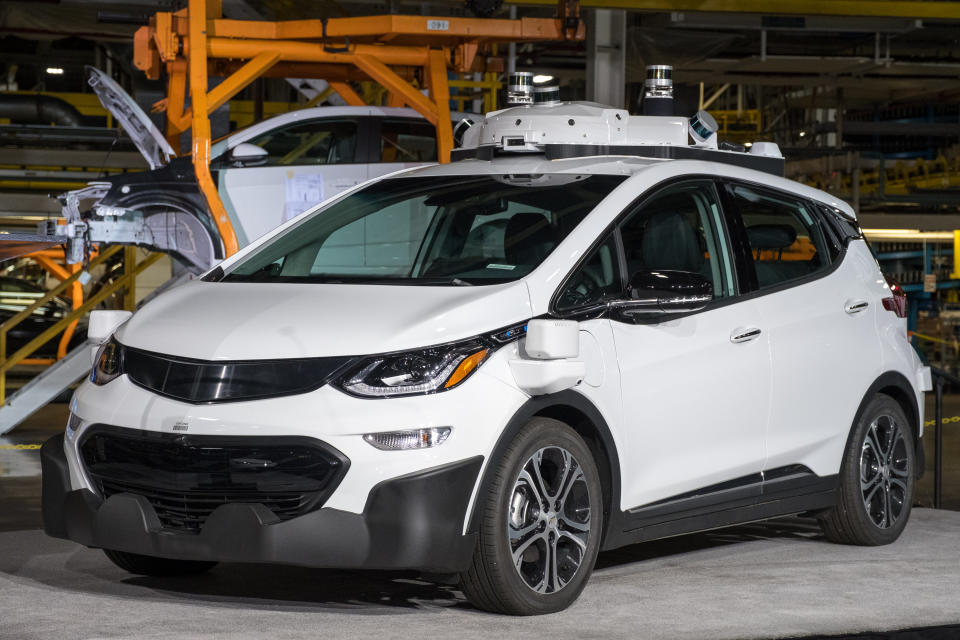 A white Chevy Bolt with Cruise's self-driving hardware