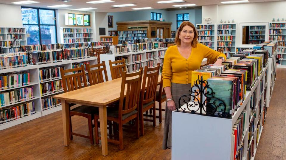 Library Director Angela Kim stands on the main level of Louis Latzer Library in Highland where the flooring was replaced with a durable wood laminate, the shelving and book cases were painted white and all the wall were painted and repaired. The main library was constructed in 1929 with an addition constructed in 1972. When the library shut down for COVID-19, the staff took the opportunity to overhaul the entire library, including some much-delayed renovations.