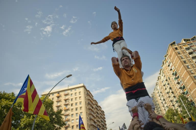 Members of the Casteller "Sagals d'Osona" perform during celebrations for Catalonia's National Day in Barcelona on September 11, 2015